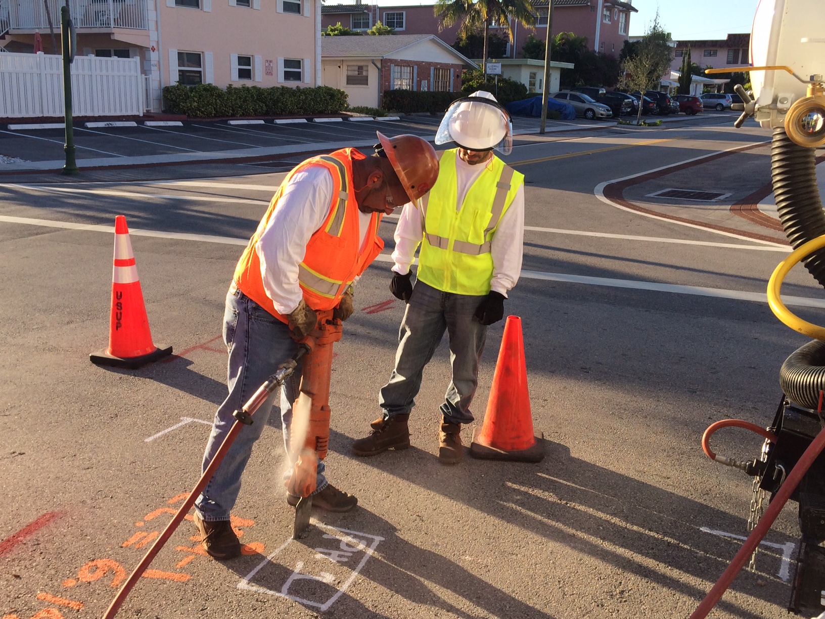 Soft dig specialist crew using air vacuum excavation around live utilities in South Florida